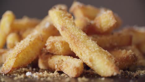 Shavings-of-cheese-falling-onto-Fried-Chips-in-slow-motion