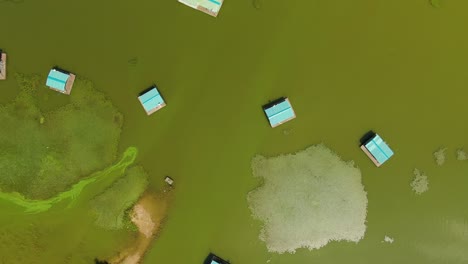 a small fishing bungalows on a lake