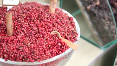 pink peppercorns in a glass bowl