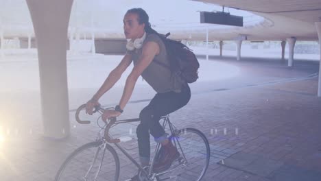 animation of light spots over biracial man cycling