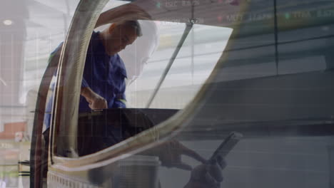 animation of caucasian woman using digital tablet and mechanic repairing vehicle in garage