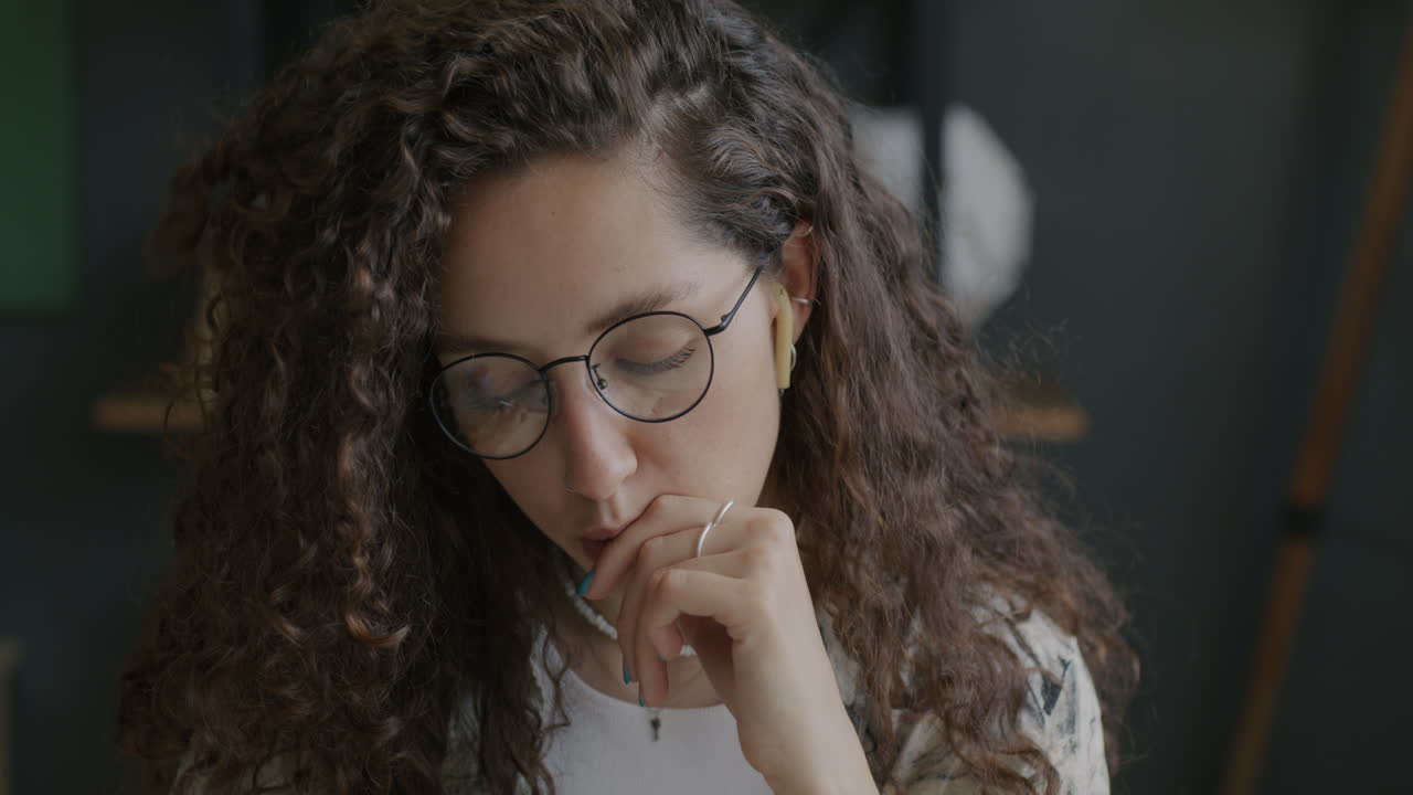 Thoughtful Woman Wearing Glasses