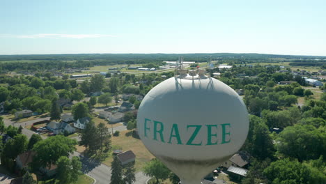 daytime aerial of frazee water tower with "frazee" printed in frazee, minnesota