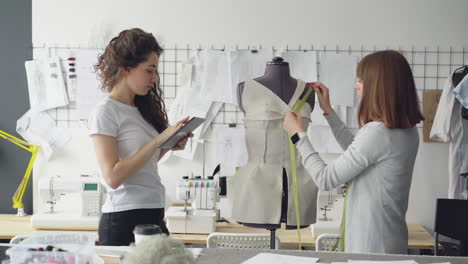 fashion designers working on a dress design