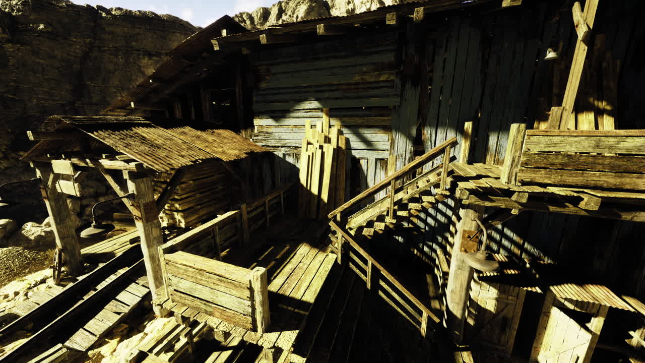 Old wooden structure amidst rocky landscape during bright daylight hours