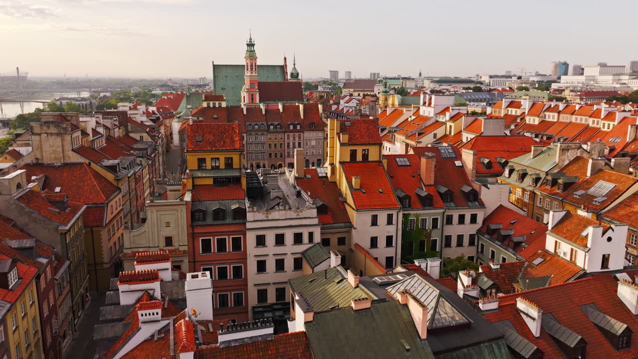 Aerial rising of Warsaw Old Town reveals square symbolizing political contrast