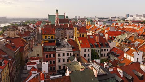 Aerial rising of Warsaw Old Town reveals square symbolizing political contrast