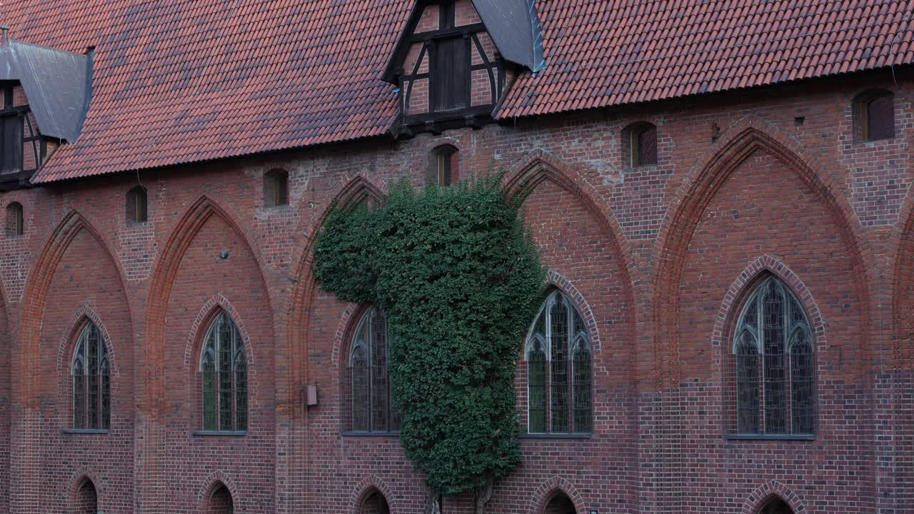 Malbork Castle, old brick architecture and windows. Tourist destination in Poland