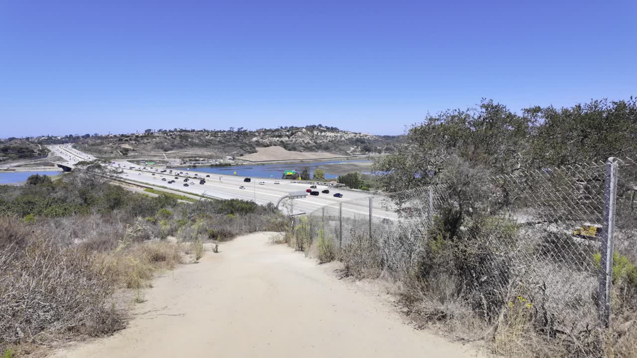 A peaceful walking scene at the upper portion of Annie’s Canyon Trail offers a panoramic view of Interstate 5 and the San Elijo Lagoon