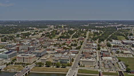 des moines iowa, descending aerial over downtown crossing the river towards the capitol building - 6k professional footage - august 2020