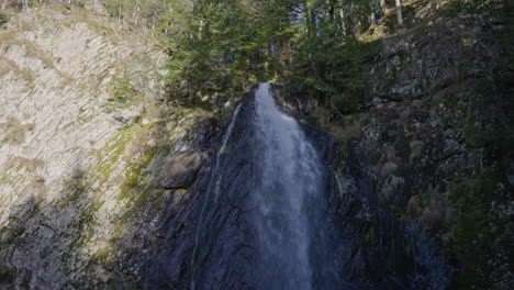 wide shot of a waterfall in france, sunny weather