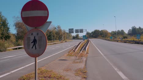 No pedestrians and no entry road sign on empty road, outside static view