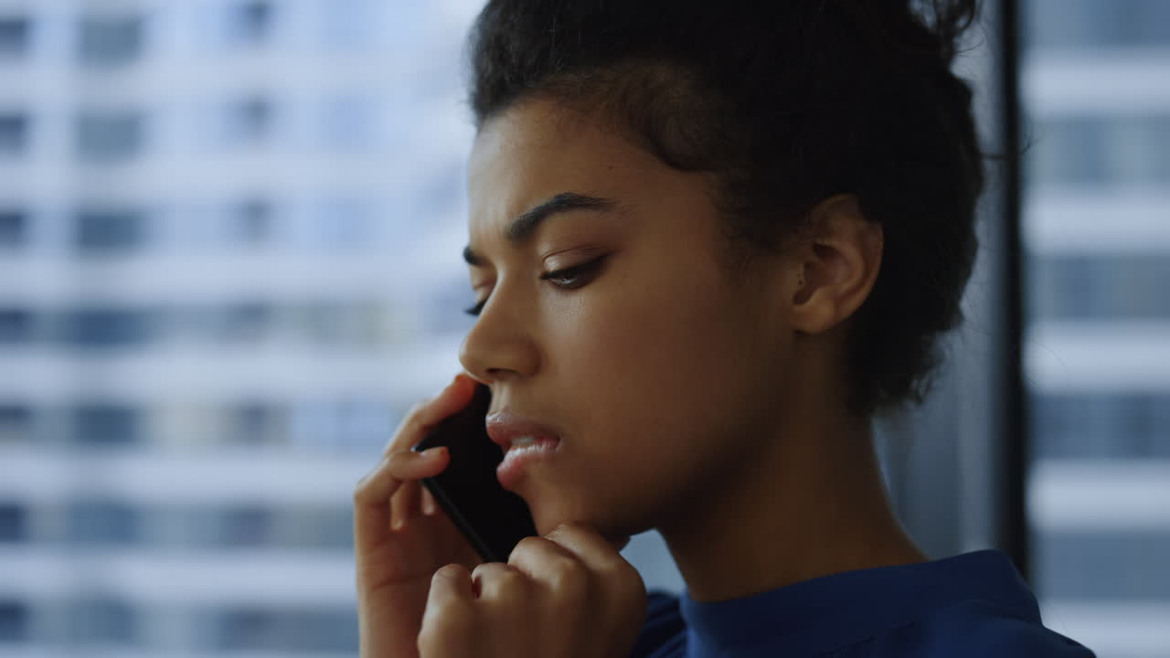 Businesswoman calling on smartphone. Female entrepreneur using cellphone