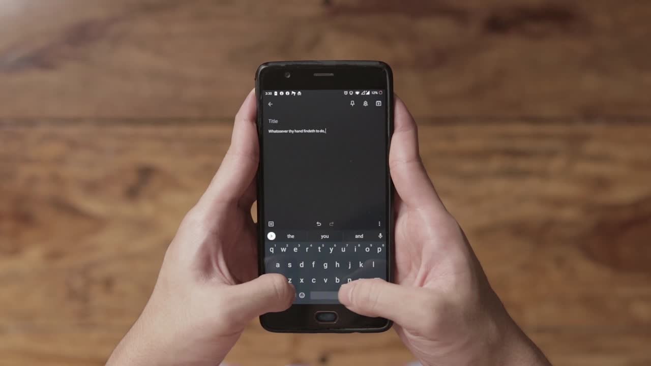 Male Hands Typing Text Message on Touch Screen Smartphone, Close-up on Cell Phone