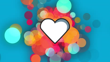 animación digital del icono del corazón contra manchas de luz coloridas sobre un fondo azul