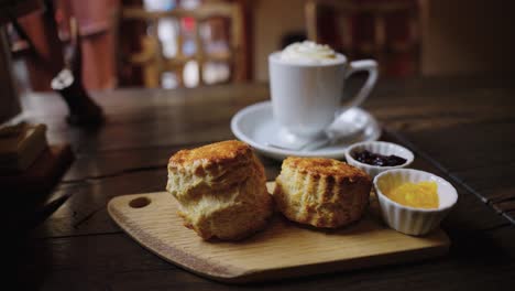 English-Scones-and-Vienna-Coffee,-Close-Slow-Motion-Shot-of-Afternoon-Tea