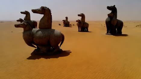 mysterious animal sculptures standing tall in a vast desert landscape
