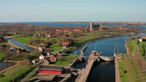 Aerial:-The-locks-of-the-Canal-through-Walcheren,-near-the-historical-town-Veere