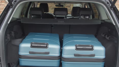 travel and camping luggage packed in the car trunk