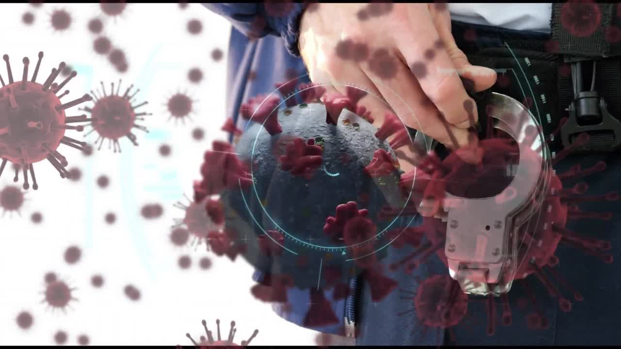 video compuesto digital de células de covid-19 moviéndose contra un hombre con esposas en el fondo