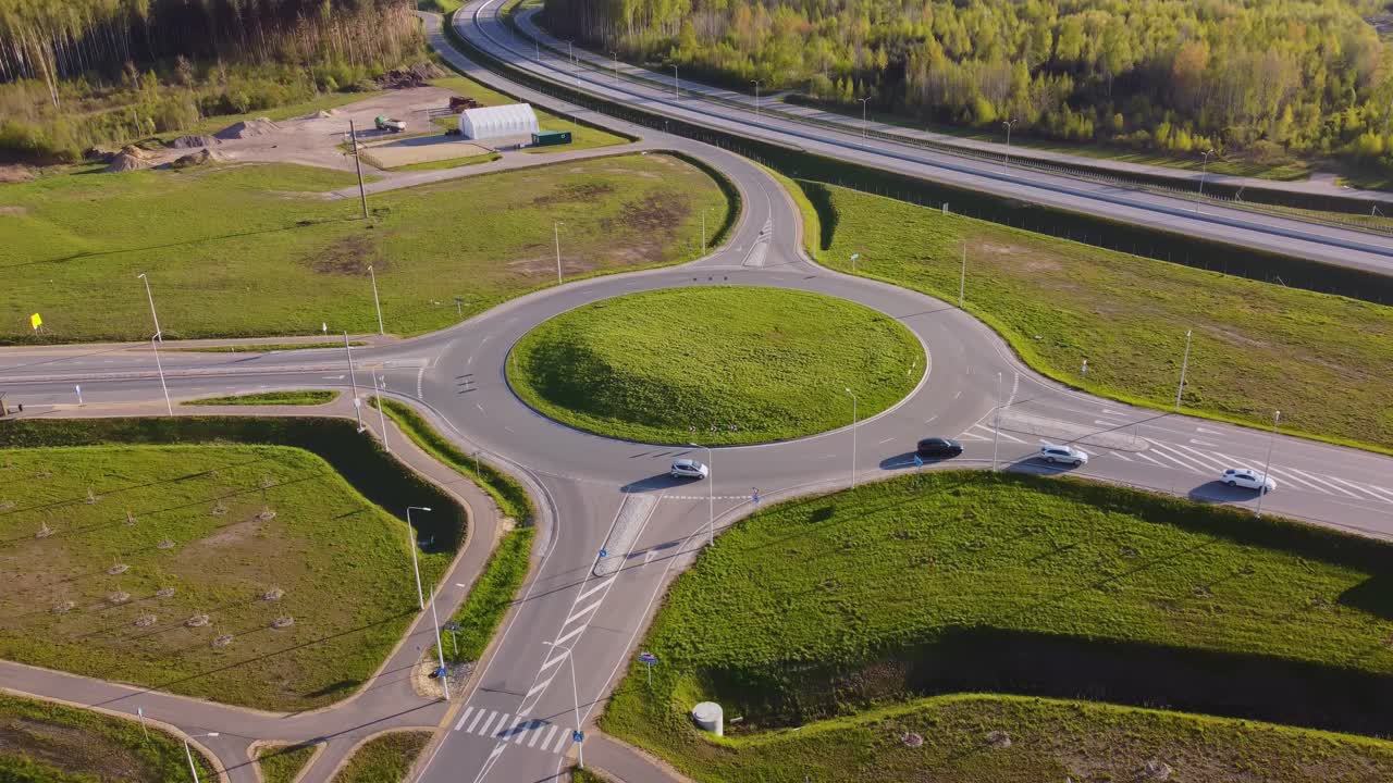 Aerial scene of vehicles navigating a busy roundabout in Katlakalns district