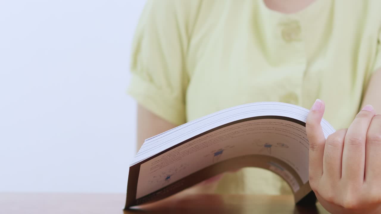 A person enjoys reading a book showcasing passion for learning a cozy environment