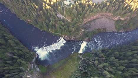 Drone-Aerial-extreme-high-view-of-the-Upper-Mesa-Falls,-a-thunderous-curtain-of-water-–-as-tall-as-a-10-story-building-Near-Island-Park,-and-Ashton,-Idaho