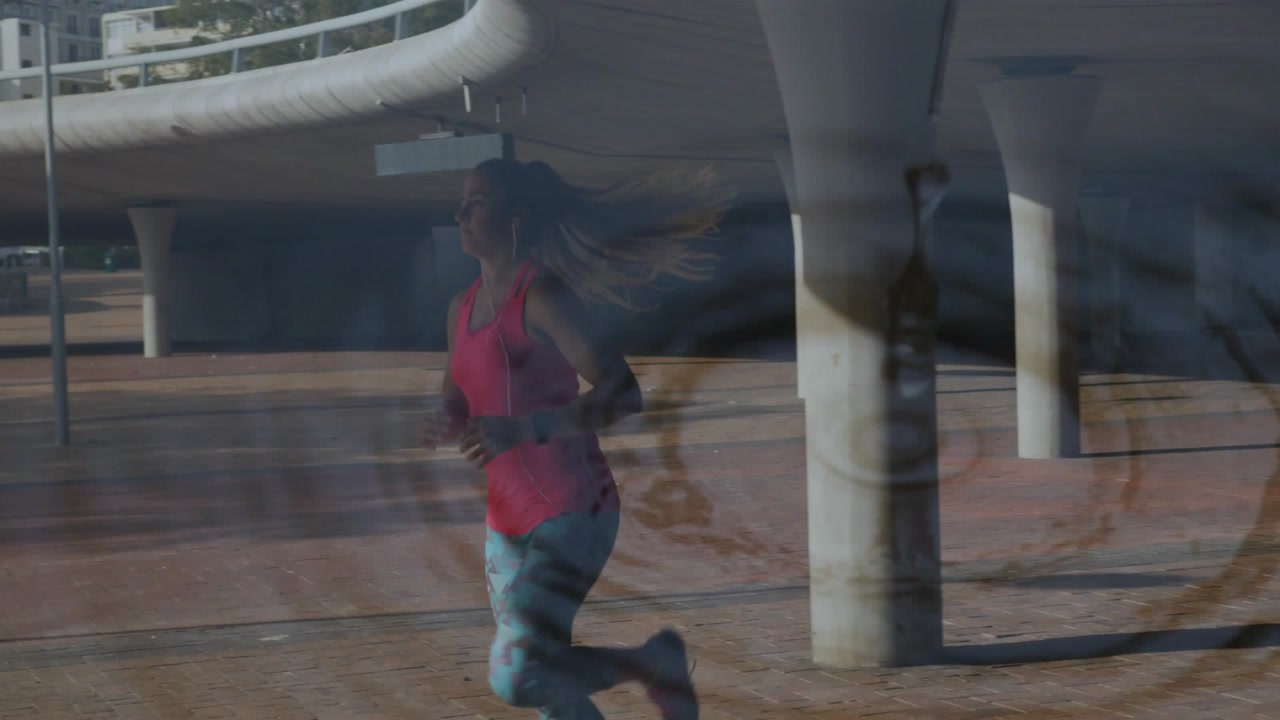 Runner entering frame running under ramp passing columns exiting left overlay rippling training