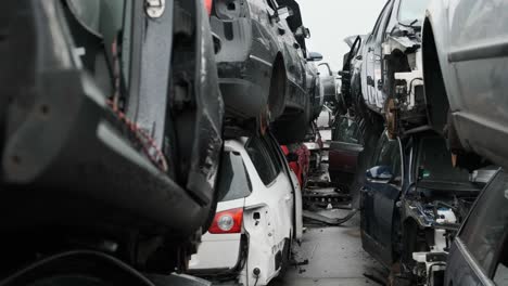 scrapyard scene, walking through a tunnel of destroyed cars