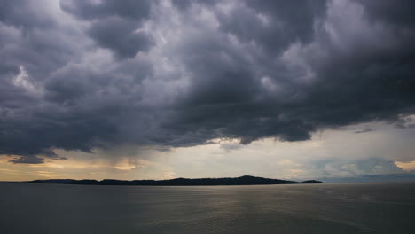 dramatic stormy sunset over an island