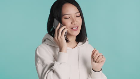 Asian-woman-having-a-phone-call-on-smartphone.