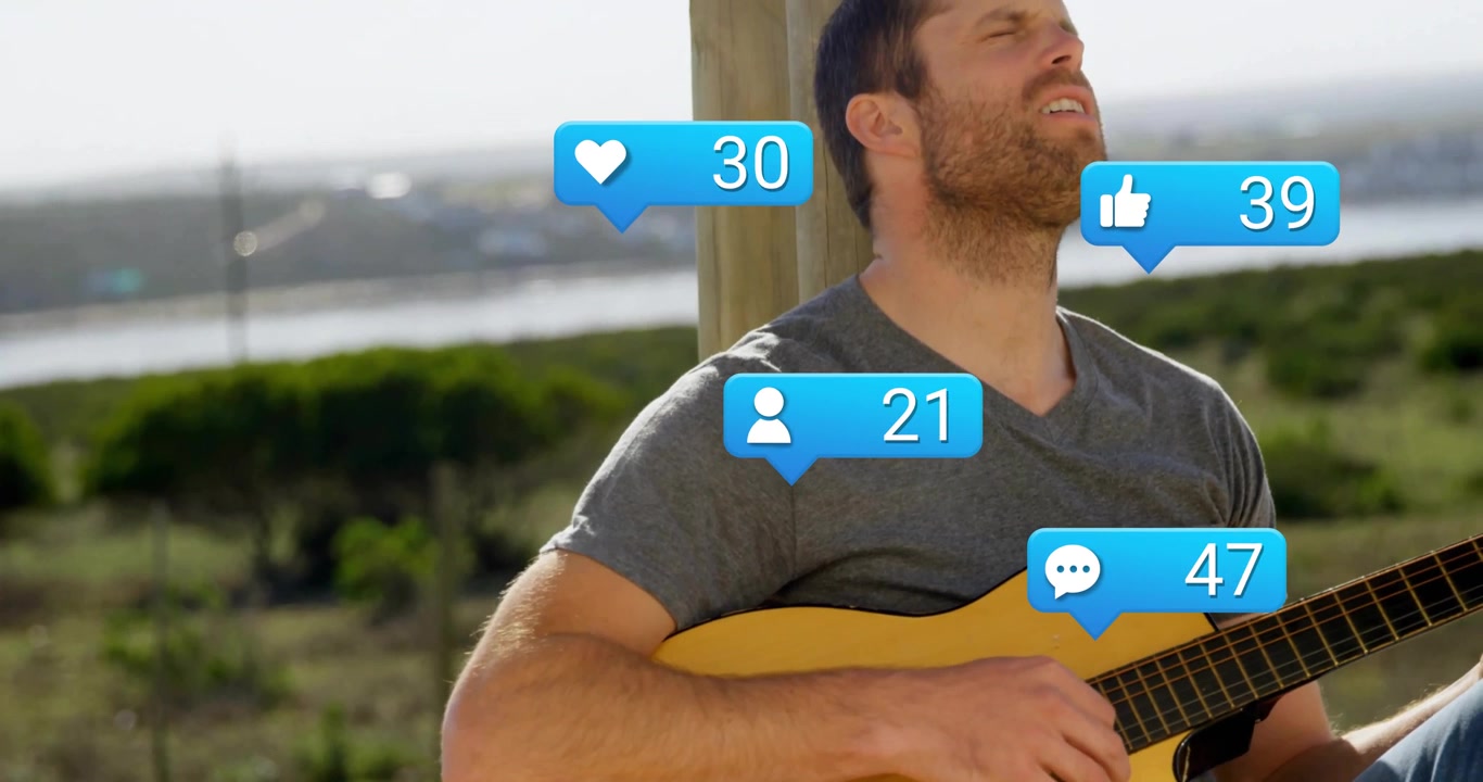 Man Playing Acoustic Guitar Outdoors with Social Media Engagement Icons