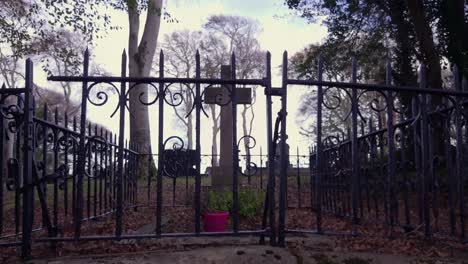 dynamic pullback shot of a peculiar grave facing the opposite direction of the others