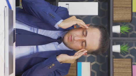 Vertical-video-of-Businessman-with-brain-tumor-experiences-headache.