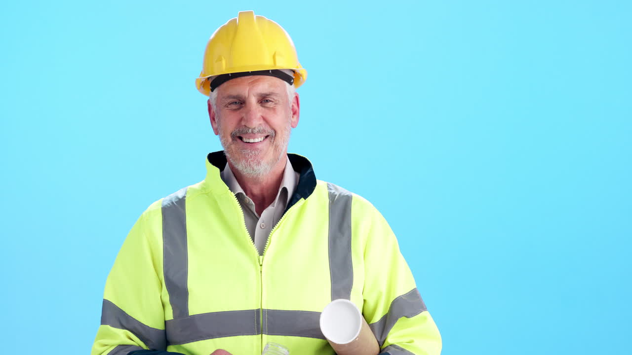 Construction worker with hard hat and blueprint