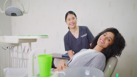 orthodontist and patient smiling with perfect