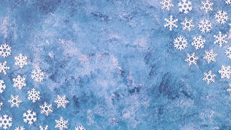los copos de nieve aparecen en las esquinas del tema azul helado stop motion