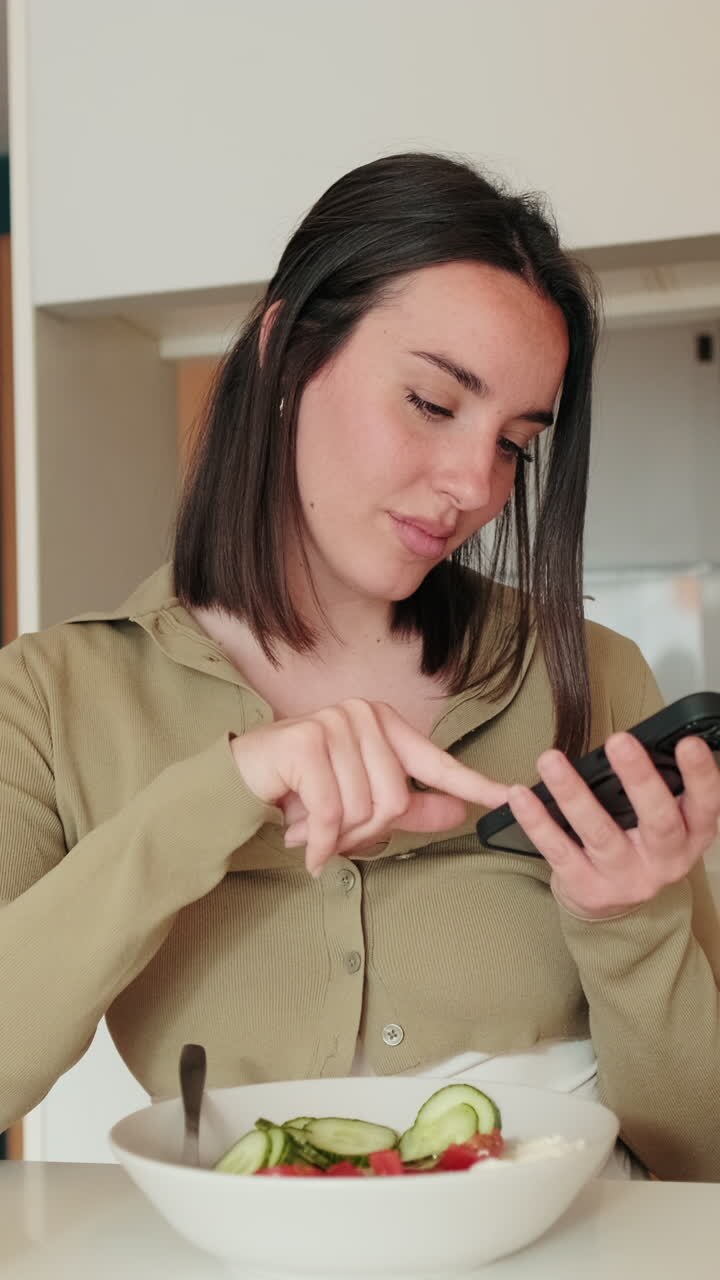 Woman Using Phone While Eating Breakfast