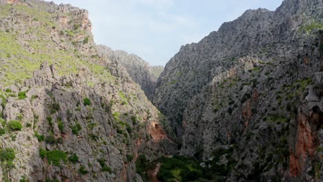 Narrow-mountain-massif-in-valley,-drone-aerial-shot