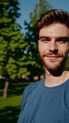 a young man smiling outdoors
