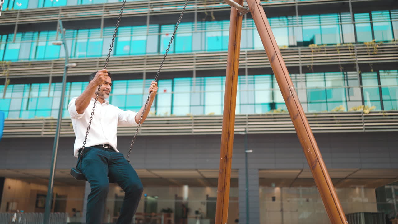 Man on Swing in Urban Setting