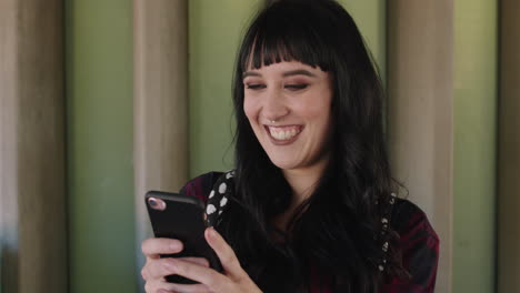 portrait-of-beautiful-trendy-woman-using-smartphone-browsing-social-media-texting