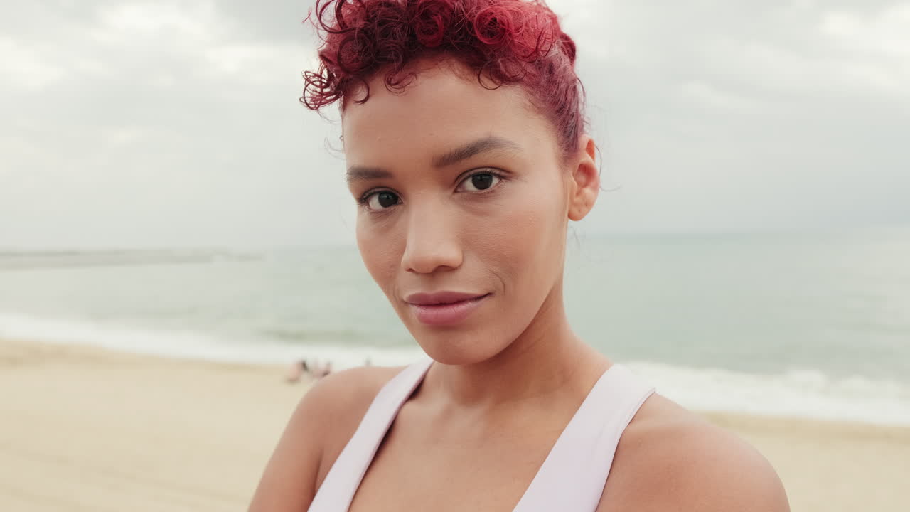 Confident Woman in Sportswear at the Beach