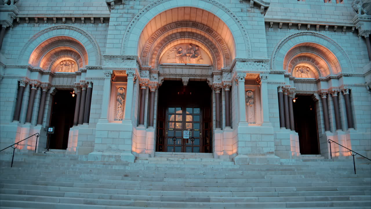 The facade of the Monaco Cathedral in the Old Town in the evening