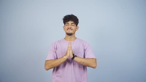 Man-meditating-looking-at-camera.