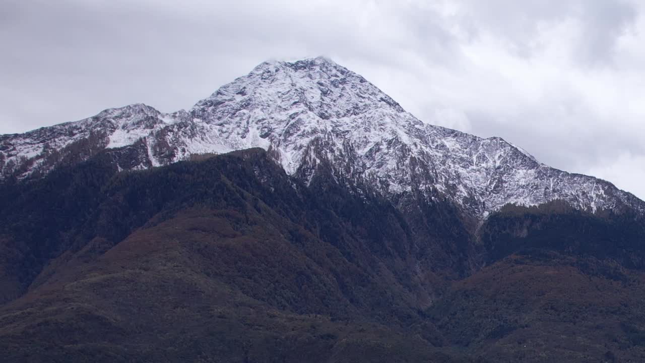 Majestic snow-capped mountain peak in the Italian Alps seen from above
