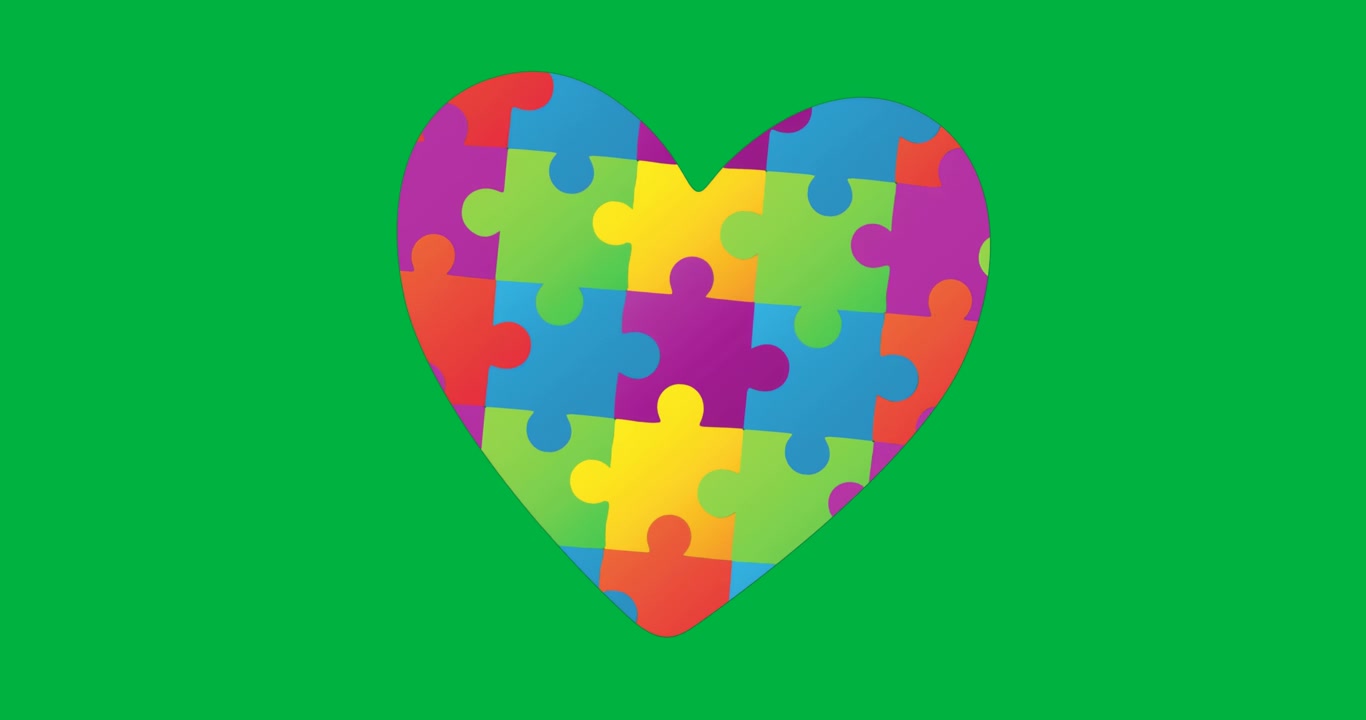 Designer grafici che assemblano un cuore puzzle colorato per un'app di salute su sfondo trasparente.