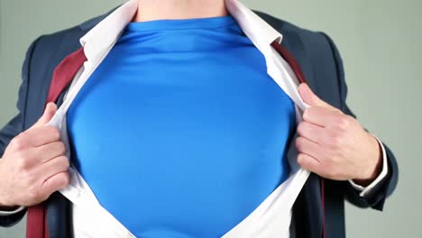 businessman opening shirt in superhero style