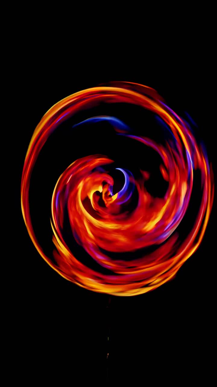 A dynamic long-exposure shot captures a fiery circle against a black background, resembling a video
