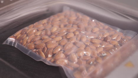 vacuum sealing whole almonds in vacuum packing machine